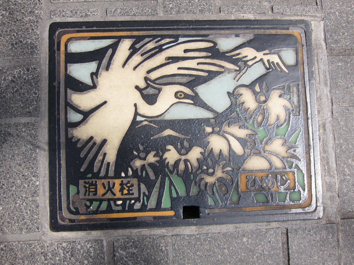 A giant bird eating smaller birds or actually giving them a stern talking.
