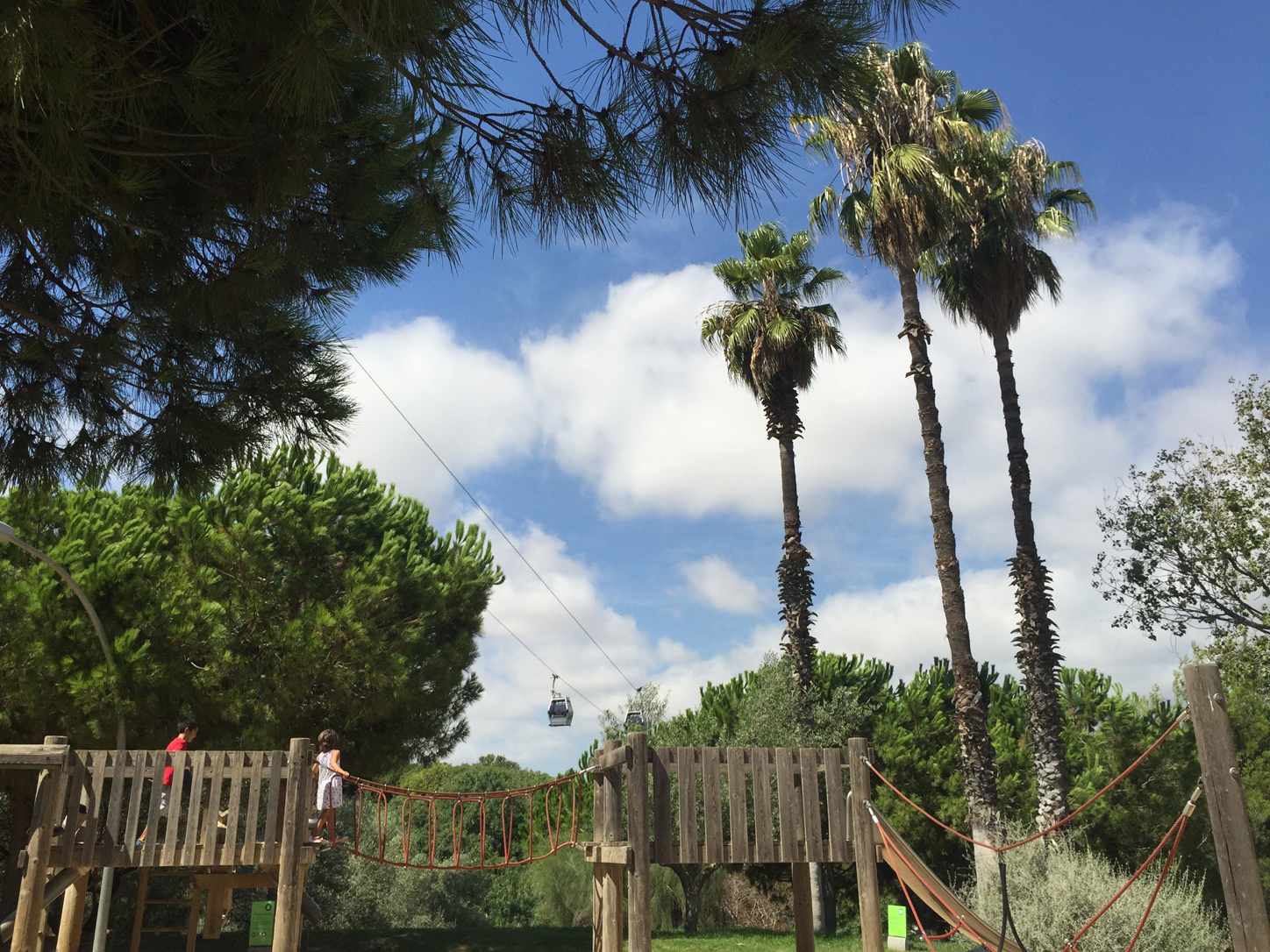 At the sandpit playground with the gondolas silently moving over our heads.