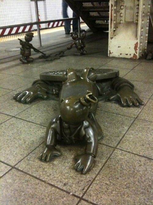 A bag of money being eaten by a crocodile from the sewers. #occupywallstreet