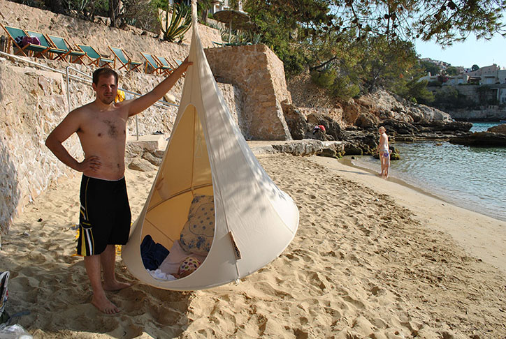 Father seemed more distressed than me about being upside down in public. Especially on a beach full of Germans, who wash baby clothing 40 times before using it.